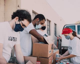 People packing donations